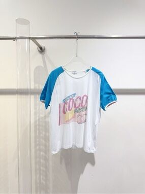 CHANEL White Tee with Bright Blue Raglan Sleeves and Multicolor COCO Graphic